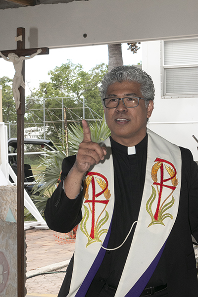 Father Jesus "Jets" Medina speaks to his parishioners before the start of the demolition blessing and groundbreaking ceremony Sept. 13. He had been on the job as parish administrator of St. Peter in Big Pine Key for six weeks when Hurricane Irma hit.