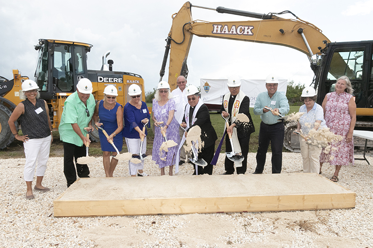 Parishioners join Miami Auxiliary Bishop Enrique Delgado and Father Jesus "Jets" Medina, parish administrator, in the symbolic groundbreaking for the new church of St. Peter in Big Pine Key.