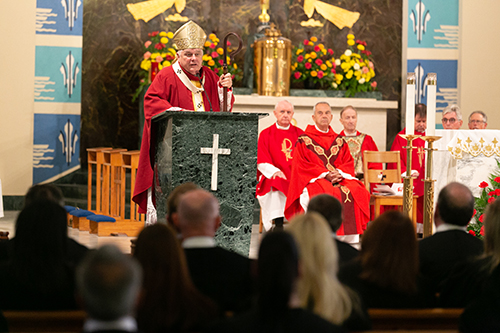 Archbishop Thomas Wenski preaches the homily at the 30th annual Red Mass of the Broward County-based St. Thomas More Society of South Florida, Sept. 26 at St. Anthony Church in Fort Lauderdale. Catholic judges, lawyers and other legal professionals attended the event.