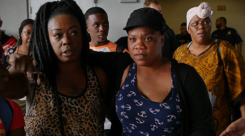 After vetting by immigration officials, residents of Grand Bahama evacuated from freeport on Bahamas Paradise Cruise Line's Grand Celebration arrive in the Port of Palm Beach Sept. 7. The cruise line returned with more than 1,100 evacuated Bahamians as well as American residents who were stranded there by the storm.
