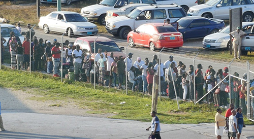 Residents of Grand Bahama line up to board the Bahamas Paradise Cruise Line's Grand Celebration Sept. 6. The ship returned to the Port of Palm Beach Sept. 7 with more than 1,100 evacuated Bahamian and American residents aboard.