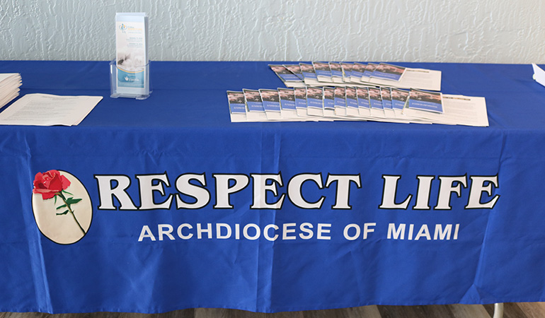 A table organized by Respect Life Office of the archdiocese featured an array of educational materials focused on respecting life and end of life issues during A Catholic Conversation about Advance Health Care Planning presentation at St. Coleman Parish in Pompano Beach Sept. 13. Organizers encouraged all to prepare for end-of-life care and to have conversations with loved ones about care wishes.