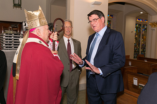 Archbishop Thomas Wenski speaks with Thomas Tatum, president of the St. Thomas More Society of South Florida, after the 30th annual Red Mass celebration at St. Anthony Church in Fort Lauderdale Sept. 26.