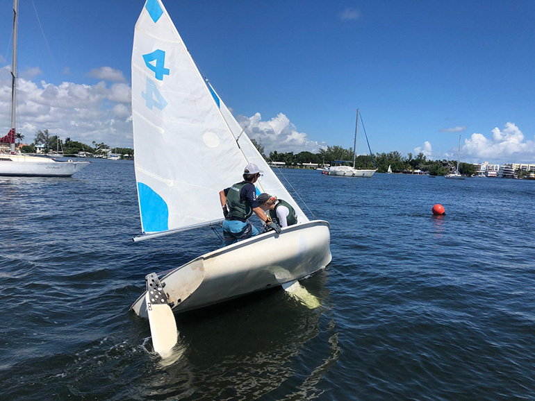 Chiara Kusmierek and Justin Callahan captain one of the Immaculata-La Salle crafts during the Sept. 28 regatta at Hollywood's North Lake.