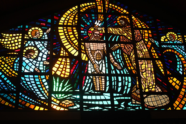 A large stained glass  window featuring an image of St. John the Baptist baptizing Jesus is a beautiful addition to St. John the Baptist Church in Fort Lauderdale and pays tribute to its patron saint, known for being a great evangelist.