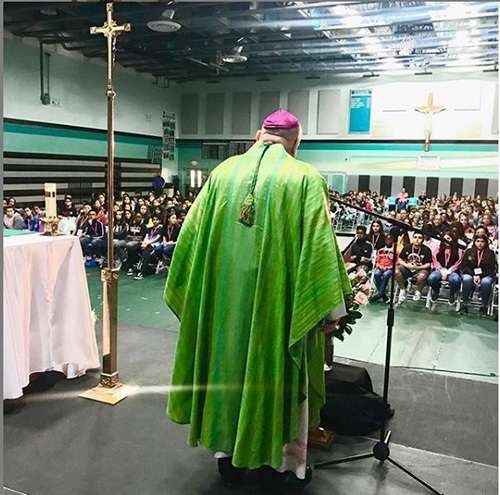 Archbishop Thomas Wenski celebrates the Sunday vigil Mass at Archbishop McCarthy High School for more than 400 middle-schoolers gathered for the "To the Heights" conference Oct. 12, 2019.
