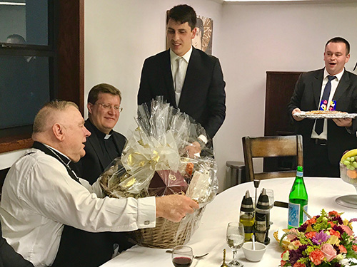 Archbishop Thomas Wenski receives a birthday gift from Redemptoris Mater seminarians after celebrating Mass with them Oct. 12, 2019. The archbishop's birthday is Oct. 18.