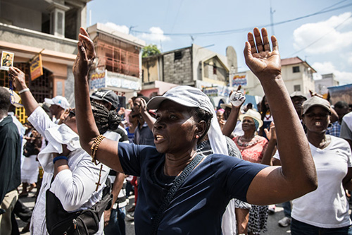 Catholic faithful demonstrate in a silent and non-violent march in Port-au-Prince against the Haitian government Oct. 22, 2019. Thousands of Catholics demanding the resignation of Haiti's president marched through the capital Tuesday, becoming the latest group to join an outcry against him. They gathered outside one of the main churches in Port-au-Prince and denounced President Jovenel Moise as corrupt and incompetent. (Photo by Valerie Baeriswyl / AFP via Getty Images)