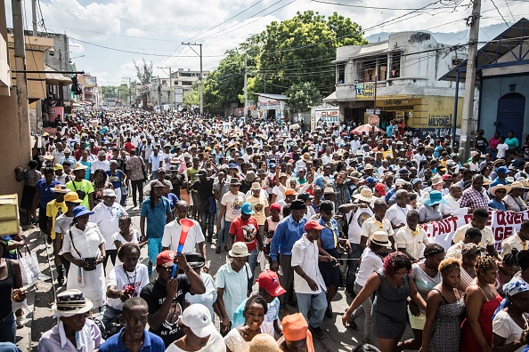 Catholic faithful demonstrate in a silent and non-violent march in Port-au-Prince against the Haitian government Oct. 22, 2019. Thousands of Catholics demanding the resignation of Haiti's president marched through the capital Tuesday, becoming the latest group to join an outcry against him. They gathered outside one of the main churches in Port-au-Prince and denounced President Jovenel Moise as corrupt and incompetent. (Photo by Valerie Baeriswyl / AFP via Getty Images)