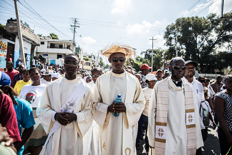 Catholic faithful demonstrate in a silent and non-violent march in Port-au-Prince against the Haitian government Oct. 22, 2019. Thousands of Catholics demanding the resignation of Haiti's president marched through the capital Tuesday, becoming the latest group to join an outcry against him. They gathered outside one of the main churches in Port-au-Prince and denounced President Jovenel Moise as corrupt and incompetent. (Photo by Valerie Baeriswyl / AFP via Getty Images)