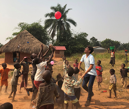 A young Hope for Kasai missionary from South Florida plays with children the village of Mpiana Nita, Democratic Republic of Congo. The organization has built a church, a sewing center, a maternity center and water collection and filtration systems since its founding in 2012.