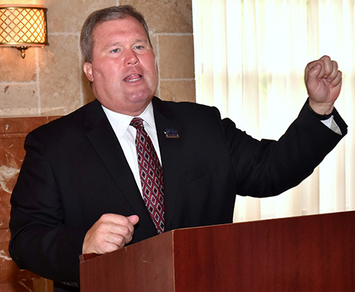 David Armstrong, president of St. Thomas University, introduces John Garvey, president of Catholic University of America, at the annual White Cross Brunch in Miami.