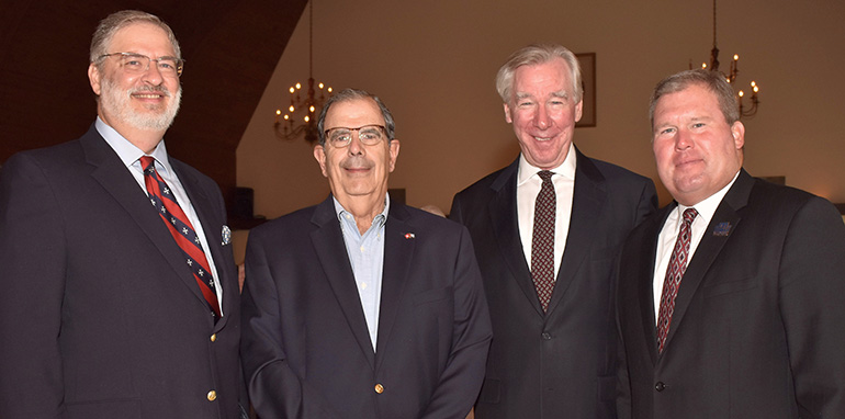 Attendees pose for photos after the annual White Cross Brunch in Miami, sponsored by the Cuban Association of the Order of Malta. From left are Luis O'Naghten, a board member of the association; Juan Calvo, past president of the association; John Garvey, the invited speaker and president of Catholic University of America; and David Armstrong, president of St. Thomas University.
