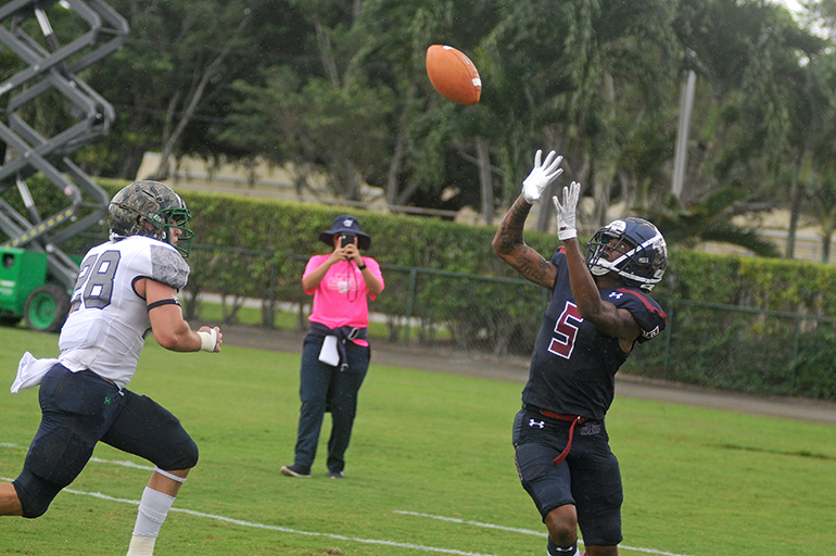 St. Thomas wide receiver D'Amaunte Oliver, right, catches a 15-yard touchdown pass over Ave Maria defender Dylan Bryan during the second quarter of their Mid-South Conference football game, Oct. 26, 2019 at Msgr. Pace High School.