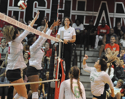 St. Brendan outside hitter Nataly Hernandez, right, tries to hit through Lake Highland Prep's block during Game 3 of St. Brendan's 25-15, 25-19, 25-21 loss to No. 1-ranked Orlando Lake Highland Prep in the teams' Class 4A state semifinal girls volleyball match at Wang Gymnasium in Orlando, Nov. 9, 2019. St. Brendan had reached the state semifinals for the first time since a state finals berth in 1980.