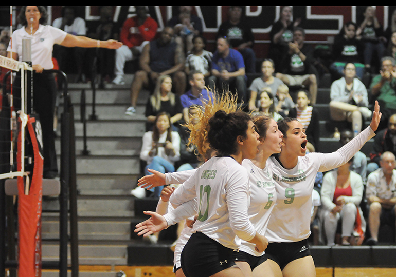 St. Brendan players (from left) Emily Diaz, Katerina Jimenez and Isabella Kouri celebrate a point during Game 3 of St. Brendan's 25-15, 25-19, 25-21 loss to No. 1-ranked Orlando Lake Highland Prep in the teams' Class 4A state semifinal girls volleyball match at Wang Gymnasium in Orlando, Nov. 9, 2019. St. Brendan had reached the state semifinals for the first time since a state finals berth in 1980.