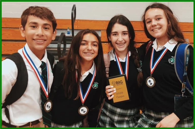 Some of the winners from St. Kevin School pose with the medals and trophies they won at Christopher Columbus High School's academic olympics competition.