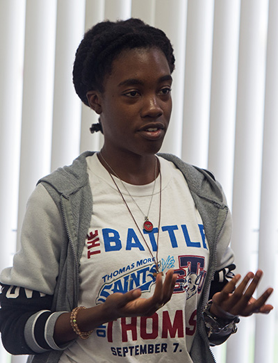 Miryam Paul, a nursing student and resident assistant, addresses the audience at St. Thomas University's presentation on domestic violence Oct. 17, 2019.