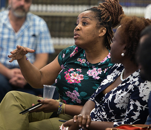 An audience member asks a question during the talk on domestic violence given by Susan Buzzi, victims advocate,  educator, and retired police officer, at St. Thomas University Oct. 17, 2019.