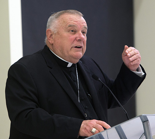 Archbishop Thomas Wenski speaks at a University of Miami forum on "Who Is Our Neighbor? Immigration in Light of Catholic Social Teaching," held in the Newman Alumni Center, Oct. 21, 2019.