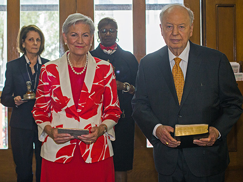Taking up the offertory at the Red Mass, starting front left: Senior U.S. District Judge Patricia Seitz and her husband, Alan Greer; behind them, U.S. District Court Judges Kathleen Williams and Marcia Cooke.Archbishop Thomas Wenski celebrated the annual Red Mass of the Holy Spirit for the Miami Catholic Lawyers Guild Oct. 24, 2019 at Gesu Church, Miami.