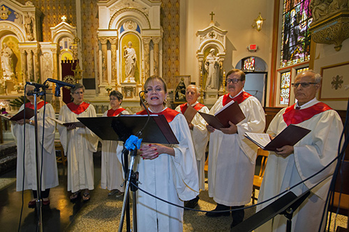 Cristina Arias leads the St. John Neumann Church Festival Choir during the annual Red Mass, celebrated by Archbishop Thomas Wenski for the Miami Catholic Lawyers Guild Oct. 24, 2019 at Gesu Church, Miami.