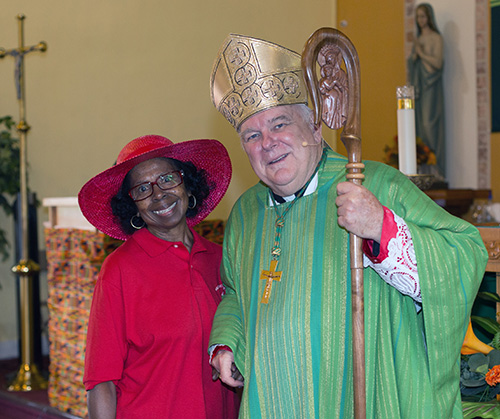 Lona Bethel Matthews poses with Archbishop Thomas Wenski after the Mass he celebrated for Black Catholic History Month, Nov. 3, 2019, at St. Philip Neri Church, Miami Gardens.