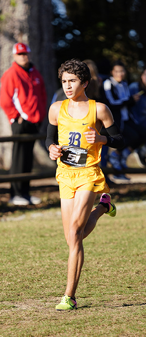 Belen Jesuit's Javier Vento runs toward a fifth place finish  in the 5K to help the school win its record-breaking 11th state cross country championship.