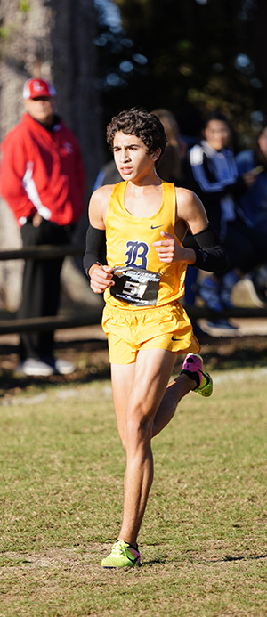 Belen Jesuit's Javier Vento runs toward a fifth place finish in the 5K to help the school win its record-breaking 11th state cross country championship.