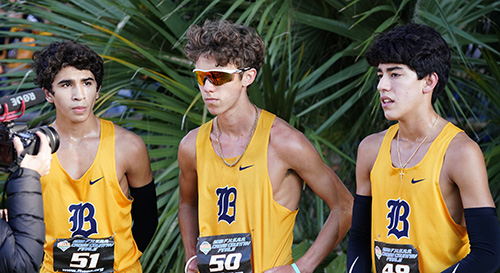 Belen Jesuit runners pose for a photo after finishing in third, fourth and fifth place in the 5K run for the state cross country championship. From left: Javier Vento, Adam Magoulas and Diego Gomez.