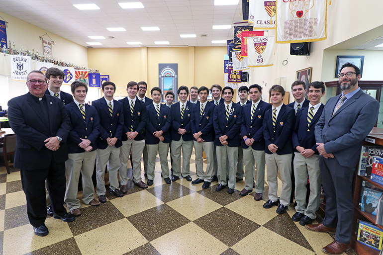 Most of the Belen Jesuit seniors who have been named National Hispanic Recognition Scholars by the College Board pose for a photograph with the school's president, Jesuit Father Guillermo García-Tuñón, and Ramón Nicosia, assistant principal for the high school.