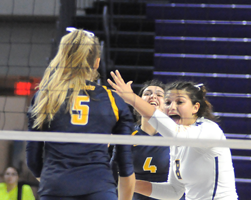 St. Thomas Aquinas libero Alyssa McBean, right, celebrates a point with Meredith Dixon (5) and Isabella Riquezes (4) during St. Thomas Aquinas' Class 6A girls volleyball state final vs. Tallahassee Leon, Nov. 15, 2019 at Suncoast Credit Union Arena in Fort Myers. Leon won the match 18-25, 25-10, 25-22, 26-24 for its second title.