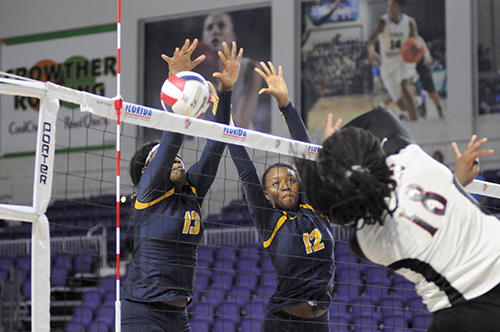 St. Thomas Aquinas blockers Zy'aire Barr, left, and Andi Cherenfant attempt to block Leon's Cailin Demps during St. Thomas Aquinas' Class 6A girls volleyball state final vs. Tallahassee Leon, Nov. 15, 2019 at Suncoast Credit Union Arena in Fort Myers. Leon won the match 18-25, 25-10, 25-22, 26-24 for its second title.