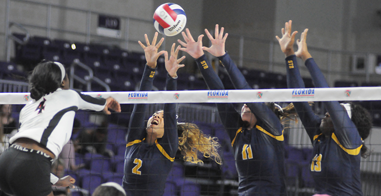 St. Thomas Aquinas blockers Mya Bowers (2), Kalin Hubbard (11) and Zy'aire Barr (13) try to block Leon's Shania Cromartie during St. Thomas Aquinas' Class 6A girls volleyball state final vs. Tallahassee Leon, Nov. 15, 2019 at Suncoast Credit Union Arena in Fort Myers. Leon won the match 18-25, 25-10, 25-22, 26-24 for its second title.