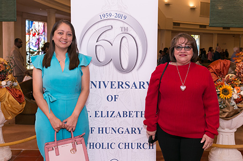 Tulia Aponte, left, and Yudy Romero, parishioners and members of the parish Hispanic community, pose in front of the banner announcing St. Elizabeth of Hungary's 60th anniversary. 


Archbishop Thomas Wenski celebrated the Mass marking the 60th anniversary of St. Elizabeth of Hungary parish, Pompano Beach, Nov. 17, 2019.