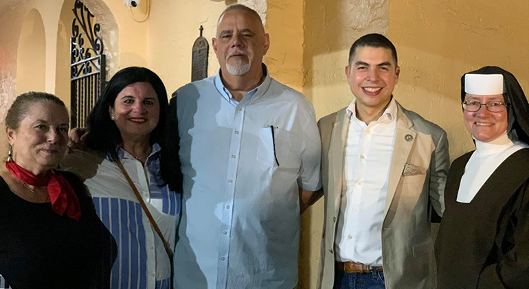 Posing for a photo after the dedication of the new Alumni Plaza at St. Theresa School, from left: Toni Pallatto, advancement director; Ana and Raul Cairo, alumni parents; Iancarlo Arispe, advancement coordinator; and the school's principal, Sister Rosalie Nagy, of the Carmelites of the Most Sacred Heart of Los Angeles.