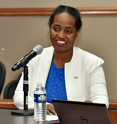 Kasa bainesay-Harbor, deputy consul general of Israel, addresses a panel discussion on Vatican-Israel relations at St. Thomas University. The event honored the 25th anniversary of the Holy See's recognition of Jewish state.