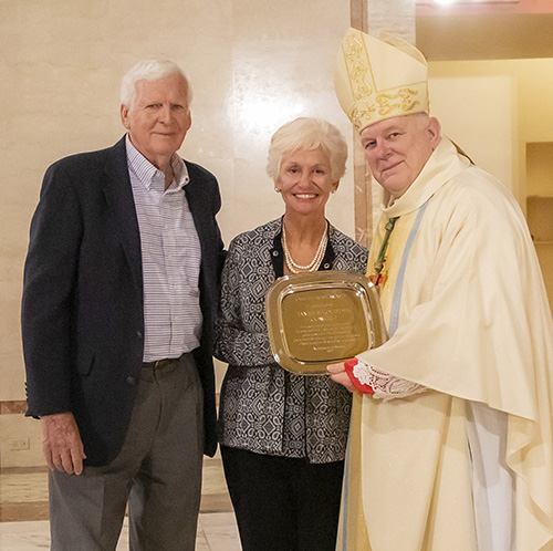 Archbishop Thomas Wenski gives Jim and Lourdes Cowgill, from the parish of St. Sebastian in Fort Lauderdale, the One in Hope award during the Thanks-for-Giving Mass celebrated at the Cathedral of St. Mary, Nov. 23, 2019.