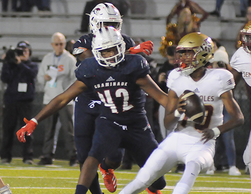 Chaminade-Madonna middle linebacker Jordan Lynch (42) chases Florida High quarterback Willie Taggart Jr. during the first half of Chaminade-Madonna's 35-20 victory in the 2019 Class 3A FHSAA football state championship game at Gene Cox Stadium in Tallahassee. The Lions won their third consecutive state championship and fifth overall.