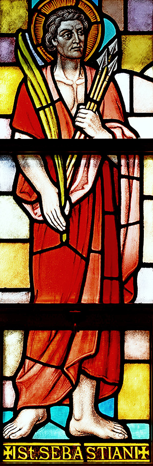 St. Sebastian carries a clutch of arrows plus a palm frond, two signs of his martyrdom, in this window at St. Sebastian Church, Fort Lauderdale.