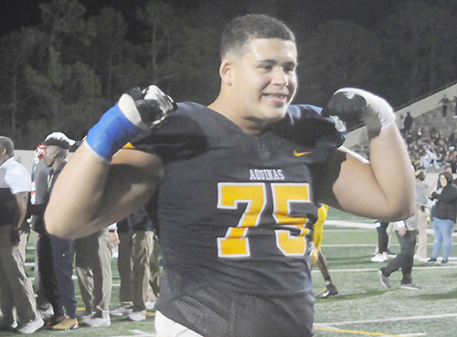St. Thomas Aquinas offensive lineman Julian Armella flexes while celebrating his team's 28-23 victory over Orlando Edgewater on Dec. 14, 2019, in the Class 7A FHSAA state football championships at Daytona Stadium in Daytona Beach. The Raiders won their state-record-tying 11th state championship.