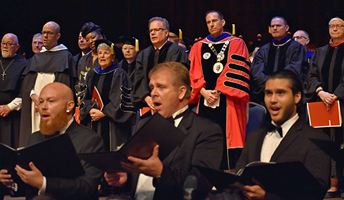 Mike Allen listens to the singing of the Barry University alma mater after his inauguration as the university's new president.