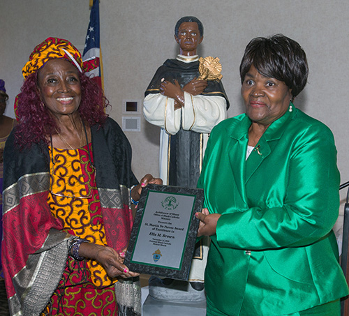 Eleanor Gardner, left, poses with Ella Brown, St. Martin de Porres Award of Excellence recipient from Visitation Church, North Miami. The awards were presented by the Office of Black Catholics of the archdiocese at the annual Black Catholic History Month awards luncheon, held at the Stadium Hotel in Miami Gardens, Nov. 16 2019.