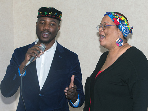 Dave McFarlane and Tamara Hospedales, of the archdiocesan Office of Black Catholic Ministry choir, perform a duet of "Agnus Dei" at the annual Black Catholic History Month awards luncheon, held at the Stadium Hotel in Miami Gardens, Nov. 16 2019.