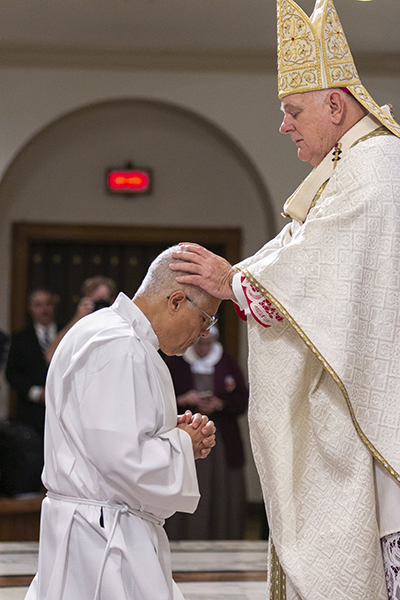 Archbishop Thomas Wenski lays hands on Enrique Ferrer of Mother of Christ parish in Miami, the moment of ordination.



Archbishop Thomas Wenski ordained nine more permanent deacons for the Archdiocese of Miami at St. Mary Cathedral, Dec. 14, 2019.