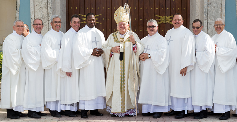 Newly ordained deacons pose for the official photo in front of St. Mary Cathedral, from left: deacons Jose Martinez, Luis Verdecia, Ernesto Sosa, Stephen Pyle, and Mesmin Augustin; Archbishop Thomas Wenski; and deacons Jorge Alvarez, Ismar Martinez; Jorge Matamala and Enrique Ferrer. 



Archbishop Thomas Wenski ordained nine more permanent deacons for the Archdiocese of Miami at St. Mary Cathedral, Dec. 14, 2019.