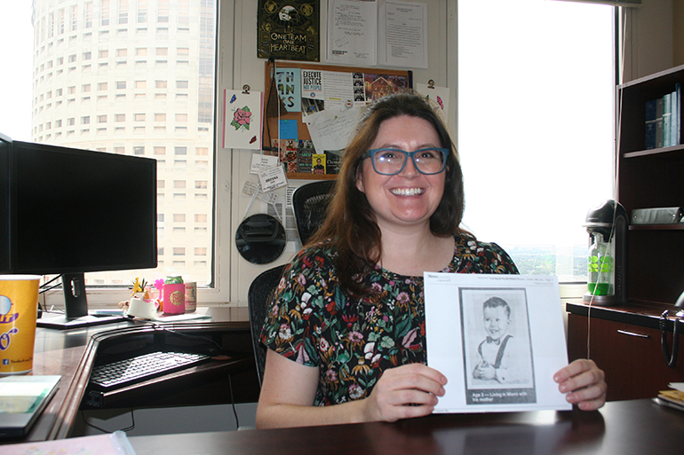 Sitting in her office at the Federal Public Defender Office in Tampa, attorney Brenna Egan holds up a photocopy of a picture taken of Bobby Joe Long when he was 3-years-old. Egan said the photo represents her client's humanity, who was once a little boy.