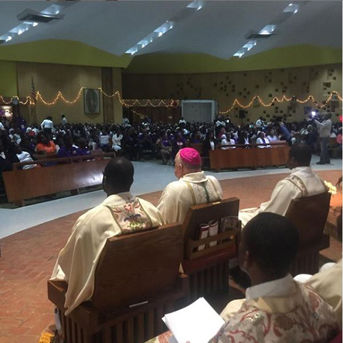 Archbishop Thomas Wenski and Haitian priests join a standing-room-only congregation at Holy Family Church in North Miami to celebrate a Mass marking the 10th anniversary of the 7.0 earthquake that hit Port-au-Prince and nearby cities Jan. 12, 2010, killing about 350,000 and leaving millions homeless. The Mass was celebrated Jan. 10, 2012.