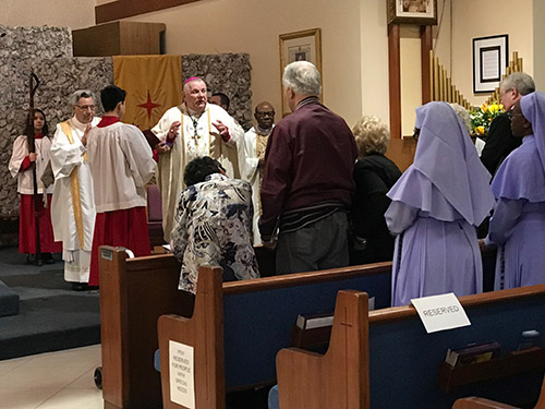 Archbishop Thomas Wenski celebrates the Mass marking the conclusion of St. Henry Parish's year-long celebration of its 50th anniversary, Jan. 11, 2020.