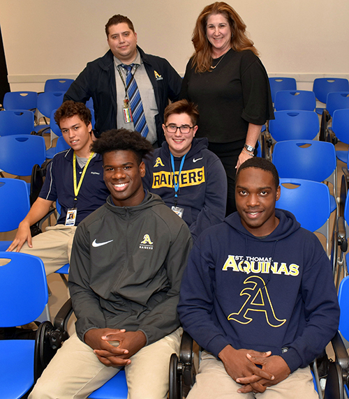 Leading members of the Aquinas Kindness club pose along with faculty sponsors. In front, from left, are Marcus Rosemy and The'Andris Freeman. Behind them, from left, are Xavier Miot and Joey Hagood. Standing are theology instructors Alfonso Balmaceda and Kathie Hagood, moderator of the club.